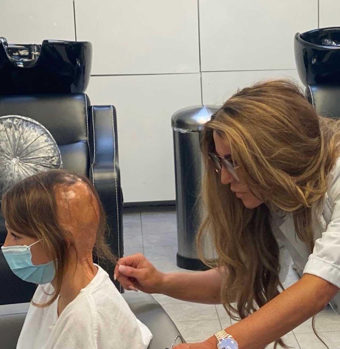 Doctor treating scalp of young girl